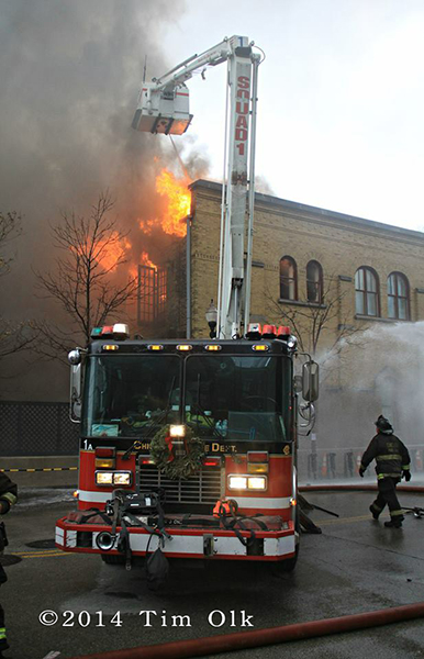 firemen battle fire with heavy flames