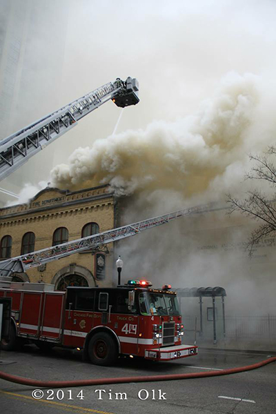 firemen battle fire with heavy smoke