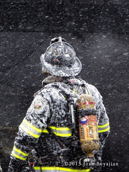 fireman covered with snow and ice