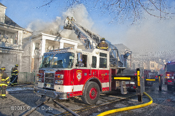 Pierce tower ladder at winter fire scene on Passaic NJ