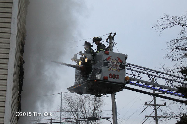 firemen in bucket with heavy smoke