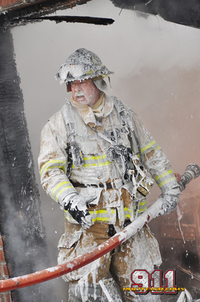 fireman covered with foam