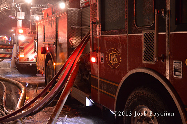fire truck at night covered with ice