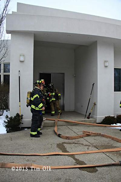 firemen at a house fire