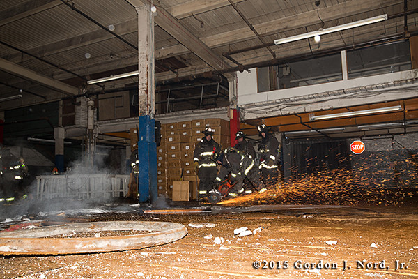 fireman just floor with saw and sparks at night