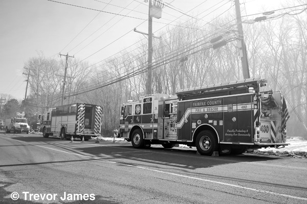black and white photo of fire trucks