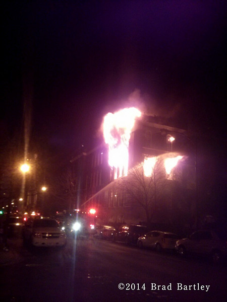 building fully engulfed by fire at night