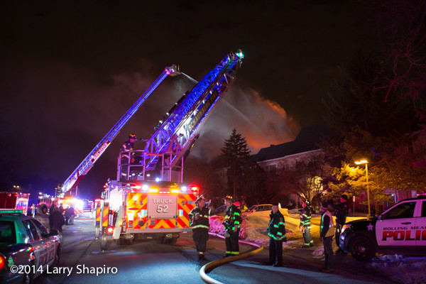 LED lighting illuminates aerial ladders at fire scene