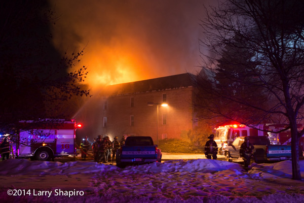 apartment building fire in the winter at night