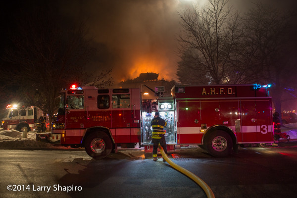 Arlington Heights Pierce Quantum fire engine working at a night fire scene