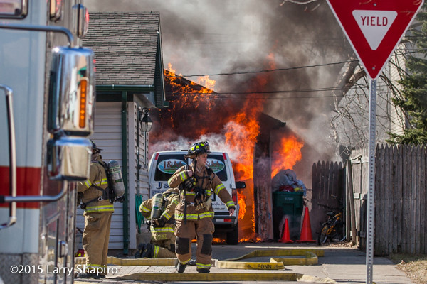 Firemen battle a garage fire in Wheeling, IL 3/17/15. Larry Shapiro photo