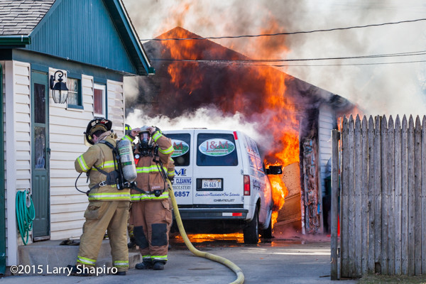 Firemen battle a garage fire in Wheeling, IL 3/17/15. Larry Shapiro photo