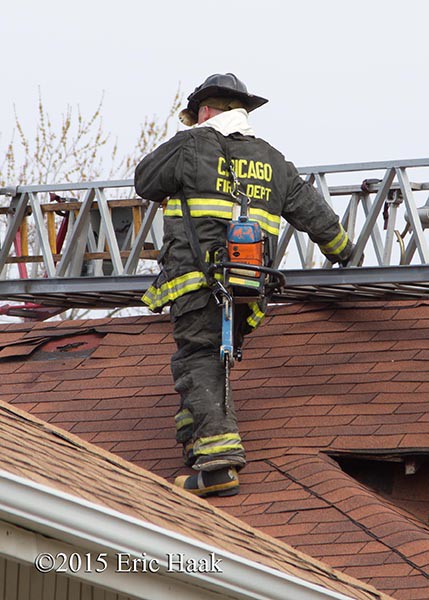 fireman on roof with ladder