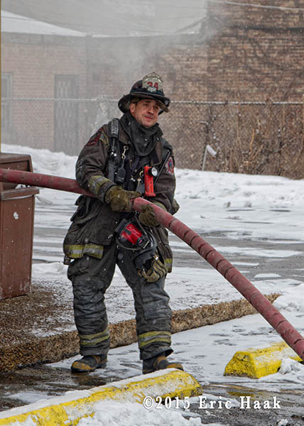 CHicago fireman with charged hose line