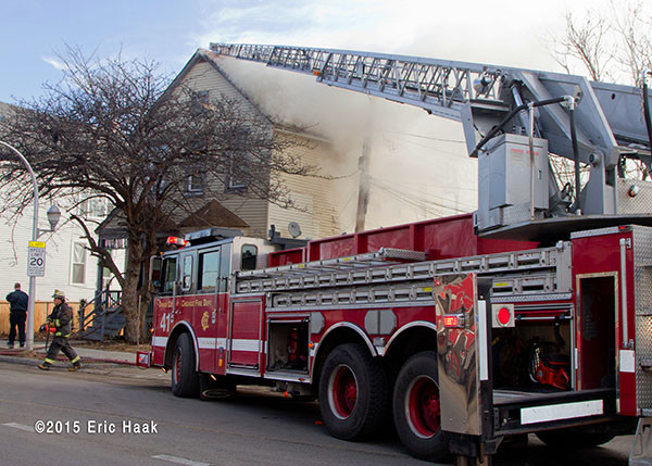 Chicago FD Truck 41 to the roof of a house fire