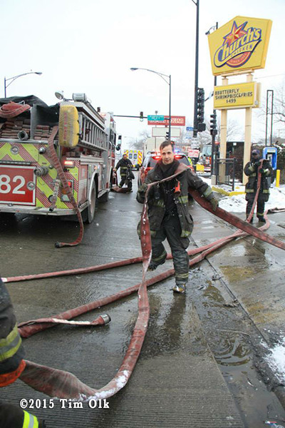 fireman pulling hose