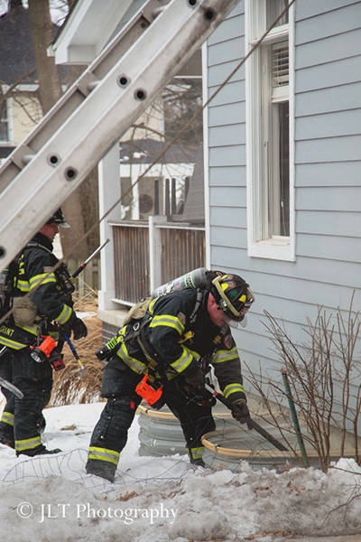 fireman break window well cover at house fire