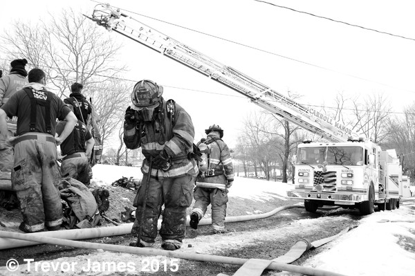 firemen at house fire scene