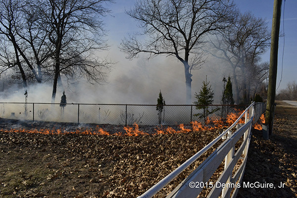 brush fire threatens homes