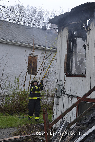 fireman working after a house fire