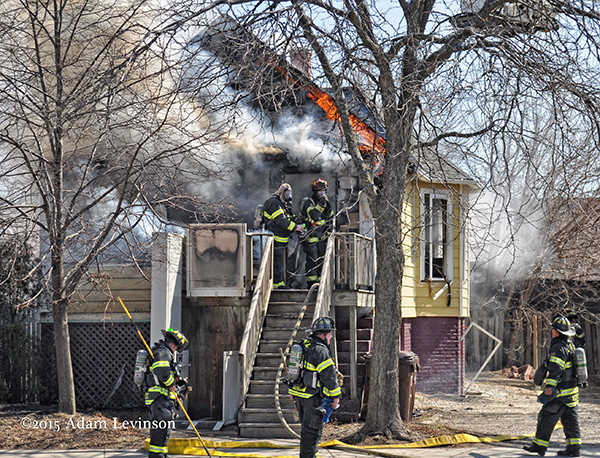 firemen enter burning house
