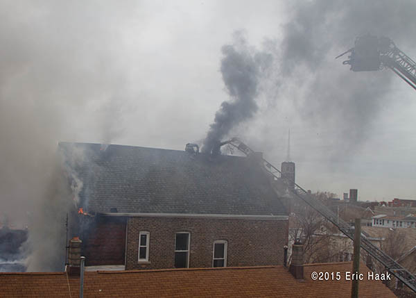 smoke from roof of house on fire