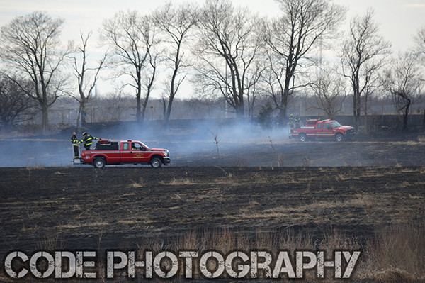 grass fire scorches large field