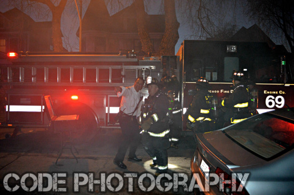 firemen at house fire at night