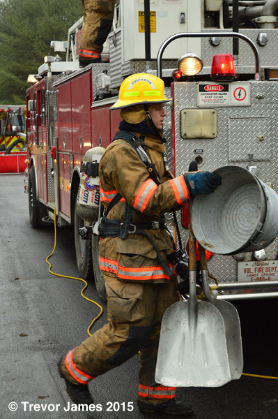 fireman with salvage tools after fire