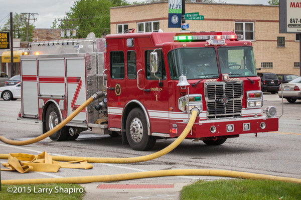 Fire engine with charged hose at scene. ©2015 Larry Shapiro