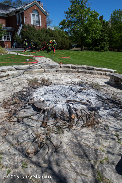 smoldering fire pit at house fire