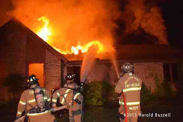 firemen battle rural house engulfed in fire