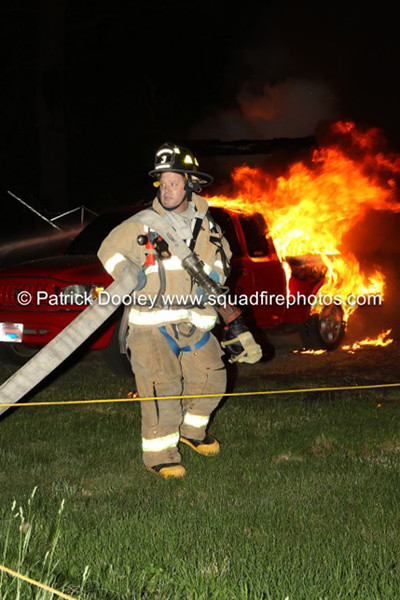 firefighter at night with flames