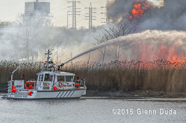 fire boat battles a large brush fire in West Haven CT