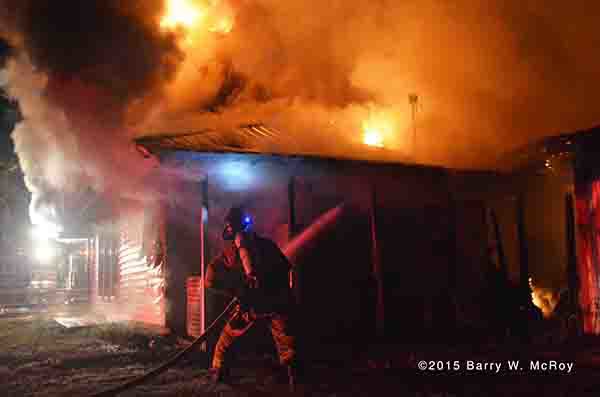 fireman battle restaurant fire at night