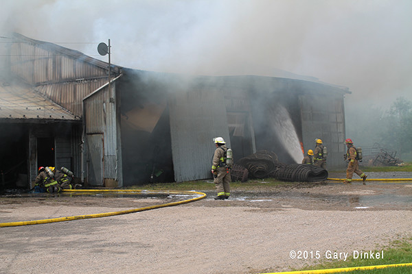 firemen in Canada battle a storage garage fire