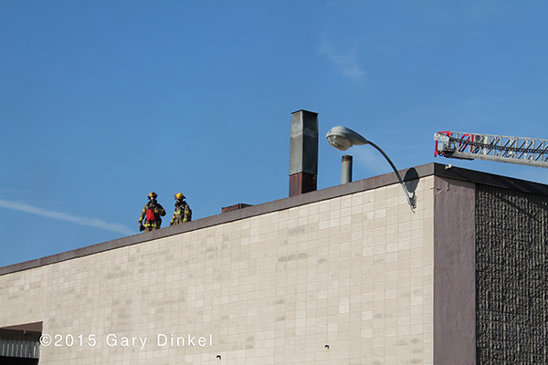 firemen on a flat roof