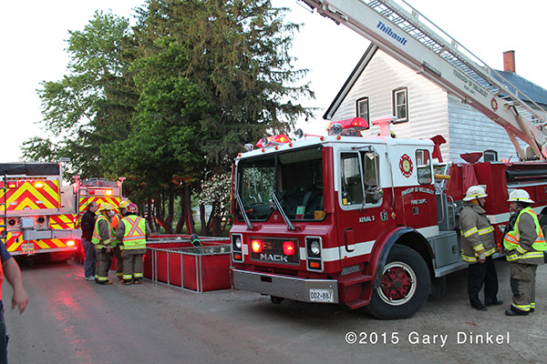 Thibault fire truck in Wellesley Township Canada drafts from a portable tank