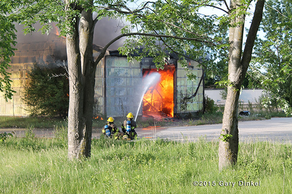 firemen in Canada battle a large garage fire