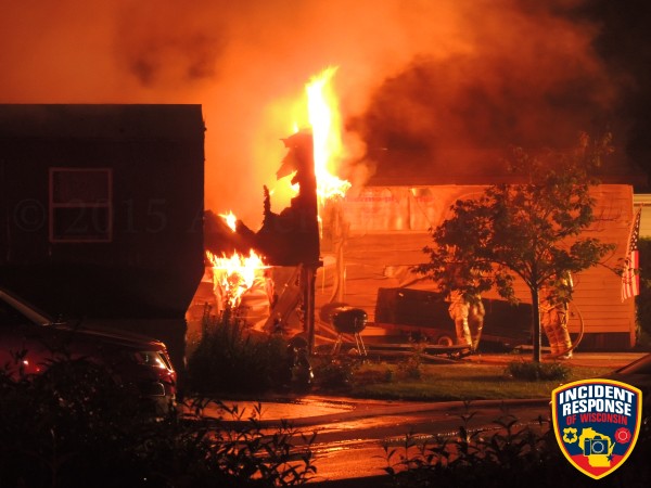 house engulfed in flames at night