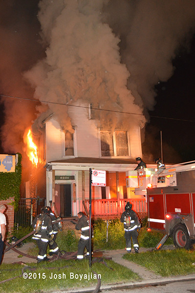 firemen battle house engulfed in fire