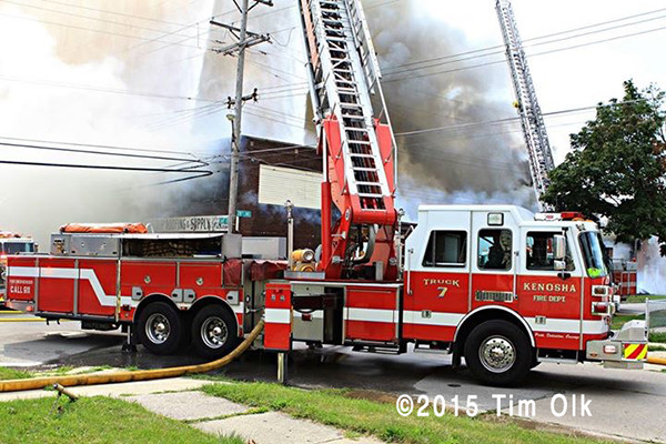 Sutphen aerial ladder working at large fire scene