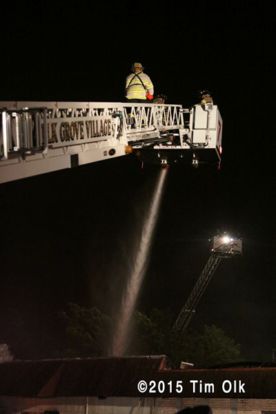tower ladder working at night fire scene 