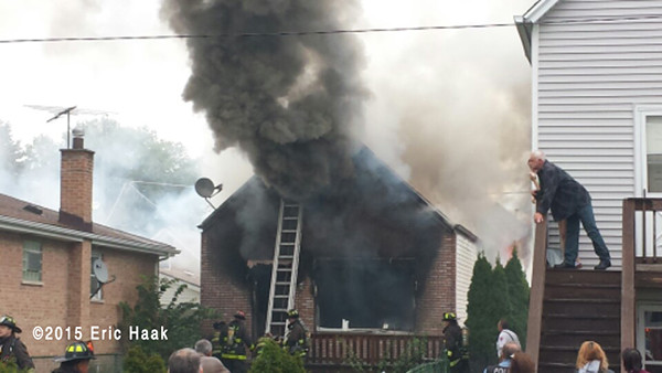 thick black smoke billow from house after fire