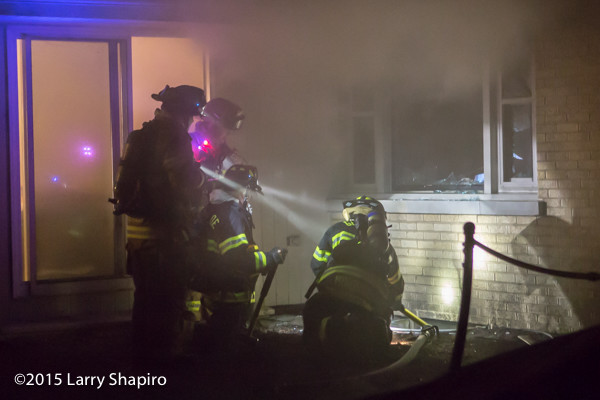firefighters immersed in smoke at night