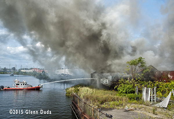 Bridgeport fire boat attacks a factory fire
