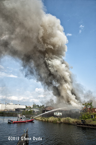 Bridgeport fire boat attacks a factory fire