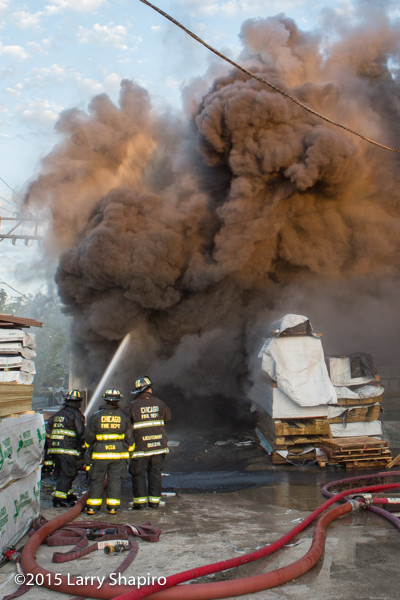 heavy black smoke pours from Chicago lumber yard on fire