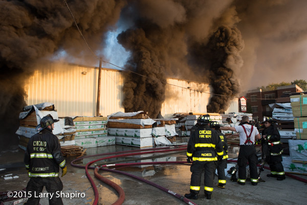 heavy black smoke pours from Chicago lumber yard on fire