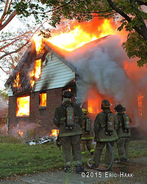 fully engulfed vacant house  fire